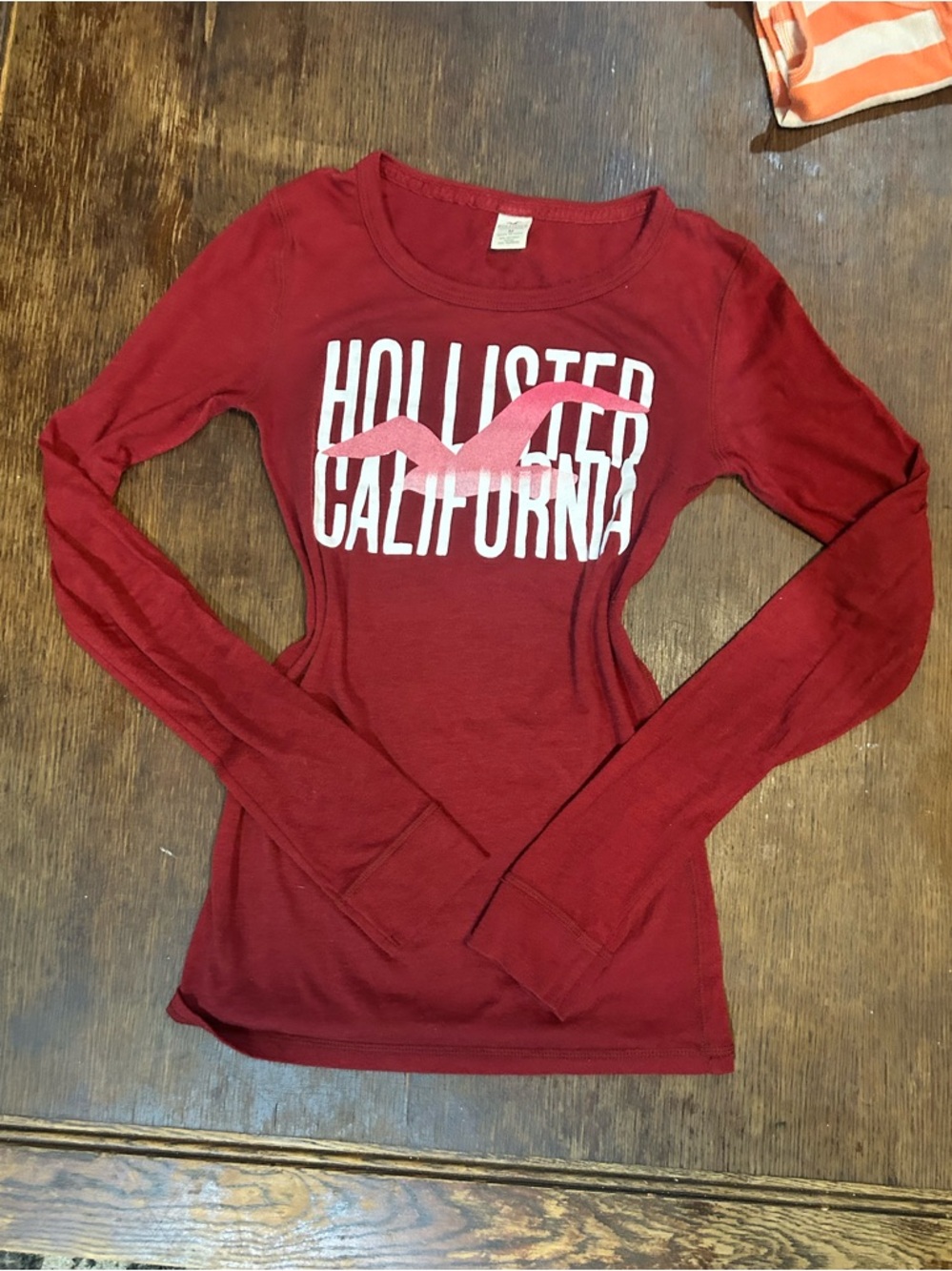 Hollister Women's Long-Sleeve Graphic Tee in Deep Red with Pink Logo